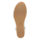 Tan sole of a shoe with 'dansko' branding on a white background