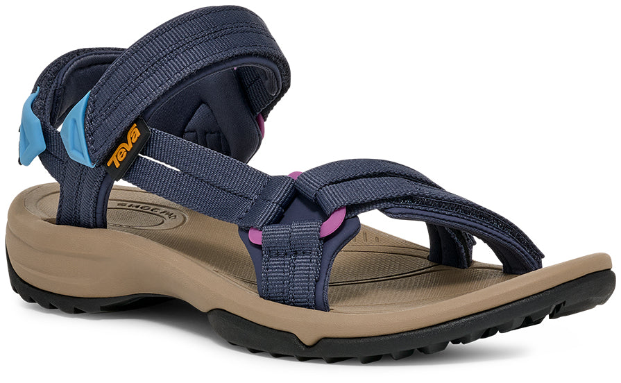 Navy blue sandal with beige sole on a white background