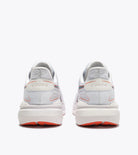 White sneakers with red accents on a white background