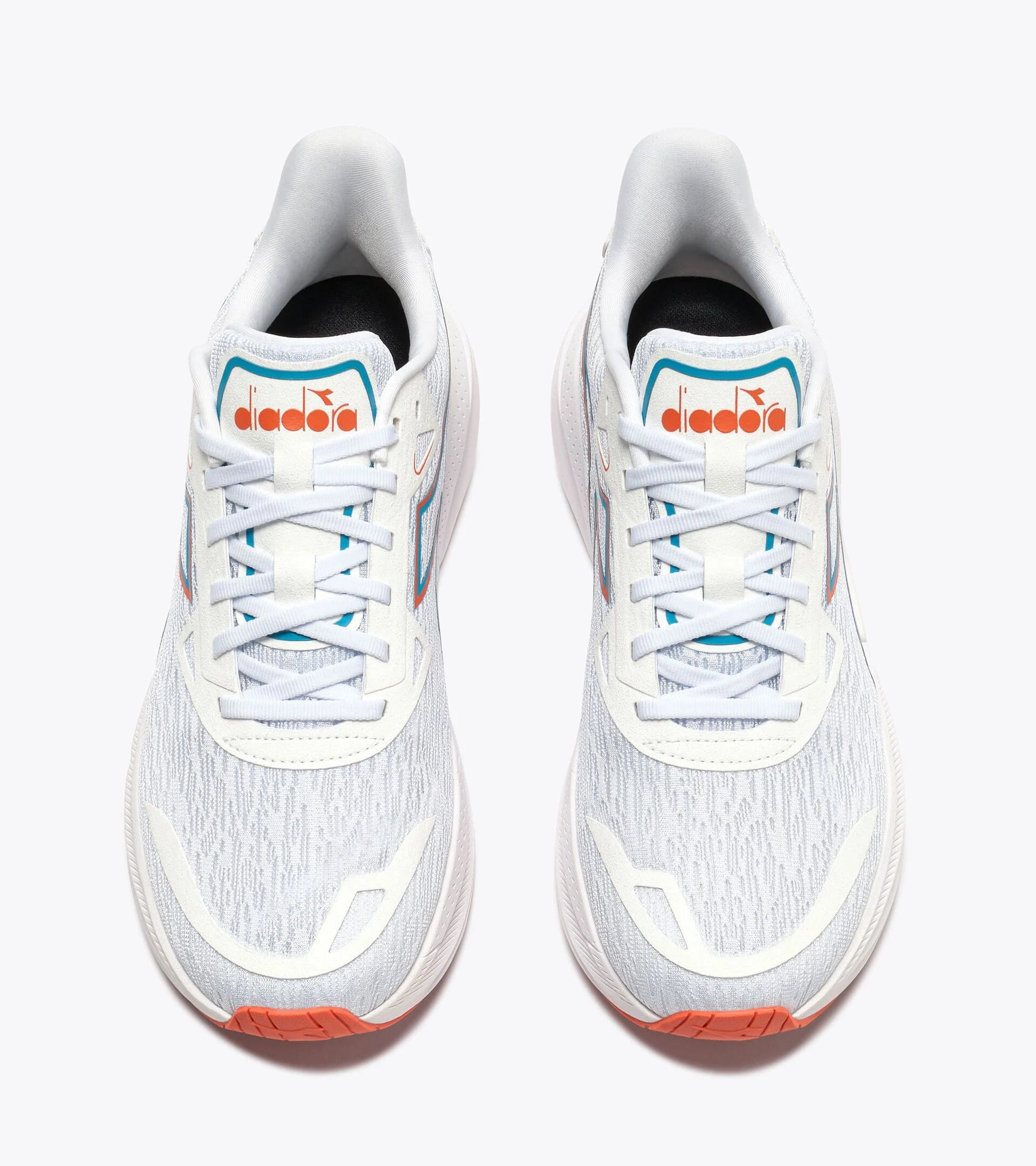 White running shoes with orange accents on a white background