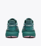 Teal running shoes with white sole on a white background