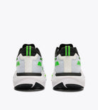 White sneakers with green accents on a white background