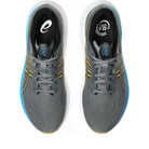 Gray running shoes with blue and yellow accents on a white background