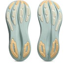 Pair of green and beige shoe insoles on a white background