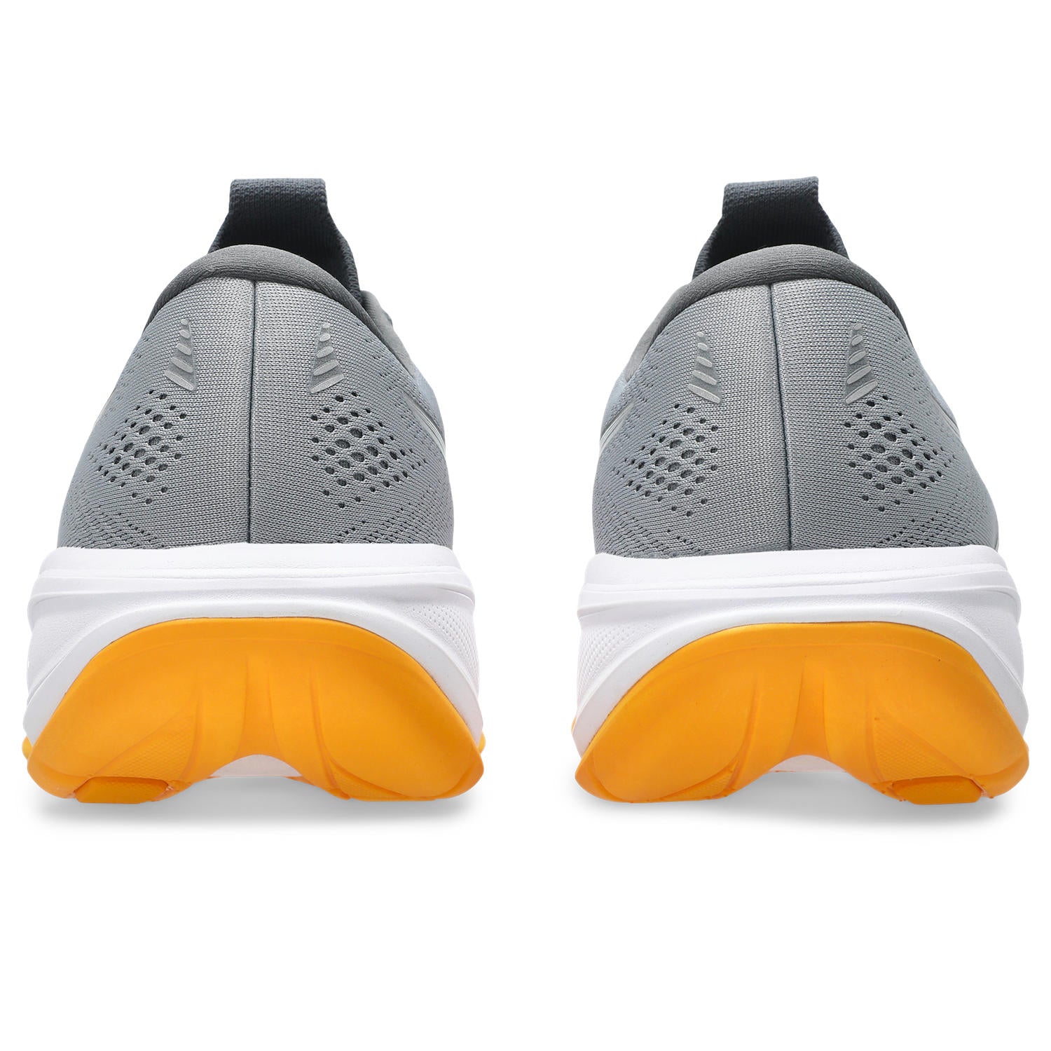 Gray running shoes with yellow soles on a white background