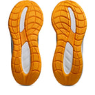 Orange and white sole of a shoe on a white background
