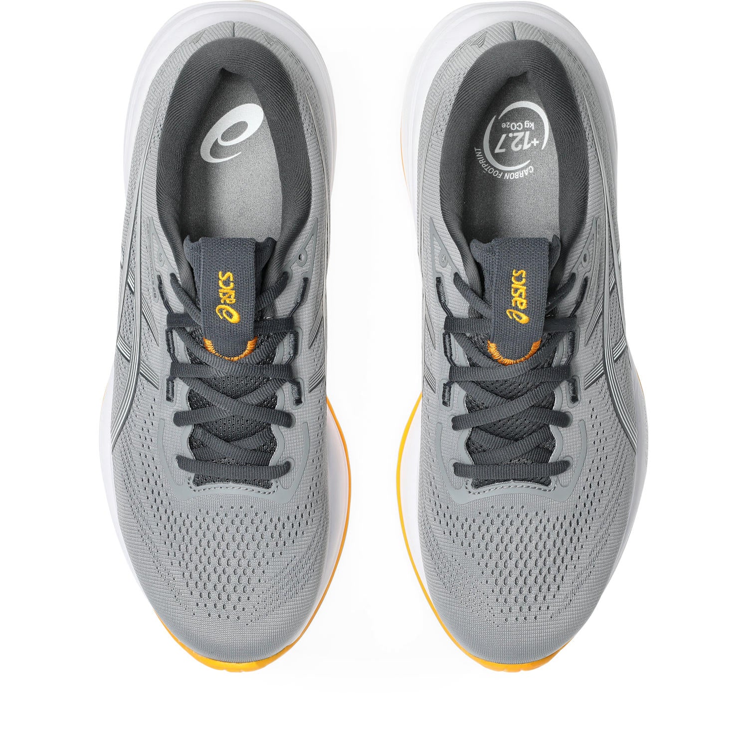 Gray running shoes with yellow accents on a white background