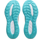 Turquoise and white shoe soles on a white background