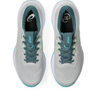 A pair of ASICS running shoes shown from a top-down view. The shoes feature a light gray and white mesh upper with teal laces, teal collar lining, and a light blue outsole edge.