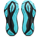 Black and turquoise shoe soles on a white background
