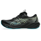 A black Asics running shoe with a thick black cushioned sole, featuring lime green and light blue accents on the side stripes and outsole.