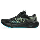 Black running shoe with green accents on a white background