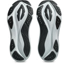 A pair of athletic shoes shown from the sole view, featuring a chunky, sculpted midsole in white and black with textured rubber outsoles.