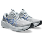 A pair of ASICS running shoes in light gray and white with blue accents, displayed on a clean white background.