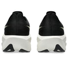 Black athletic shoes with white soles on a white background