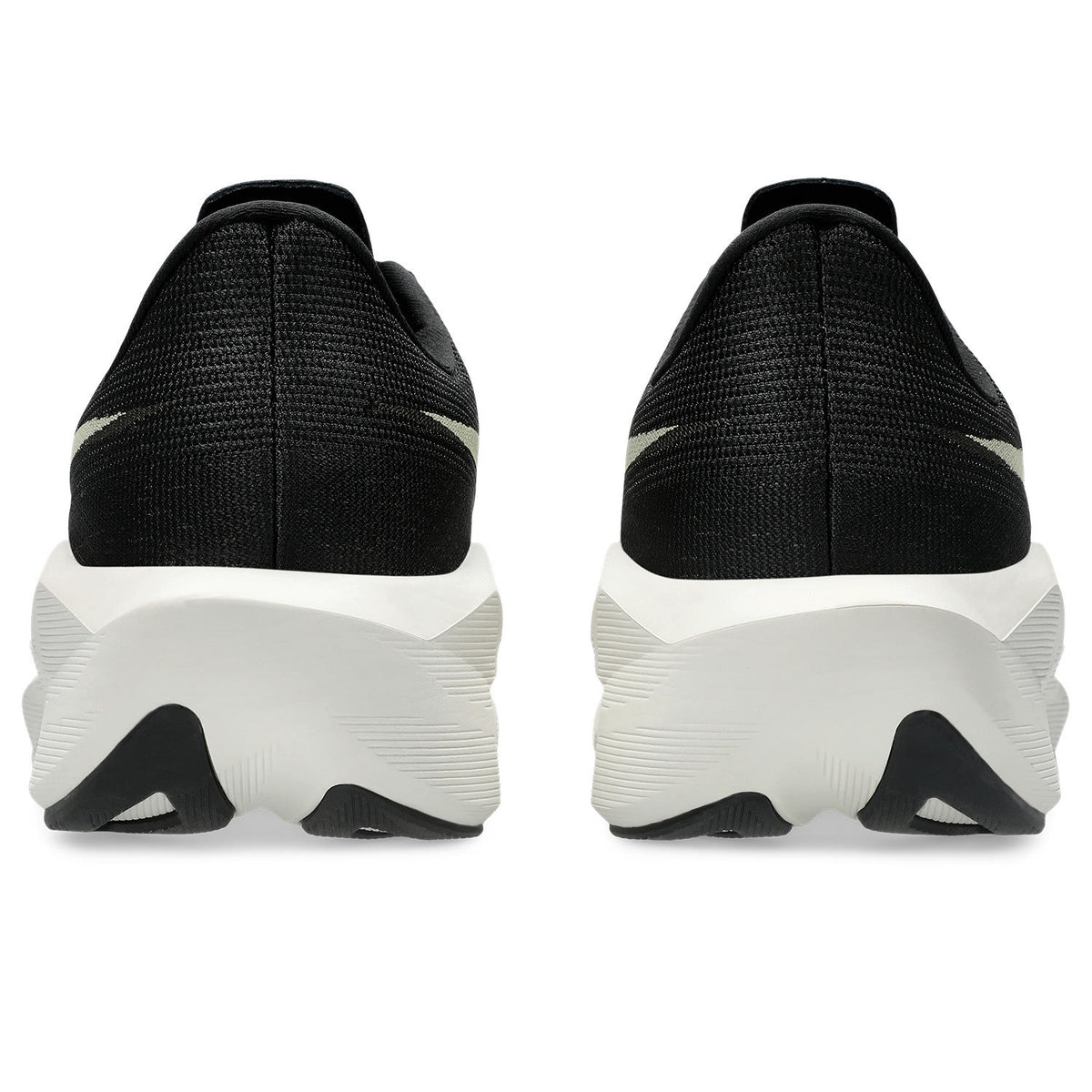 Black athletic shoes with white soles on a white background