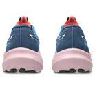 Blue running shoes with pink soles on a white background