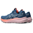 Blue and pink running shoe with visible brand logo on a white background