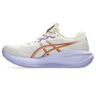 White running shoe with orange and purple accents on a white background