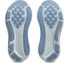 Close-up of the sole of a shoe with a textured design on a white background