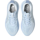 Light blue running shoes with white laces on a white background
