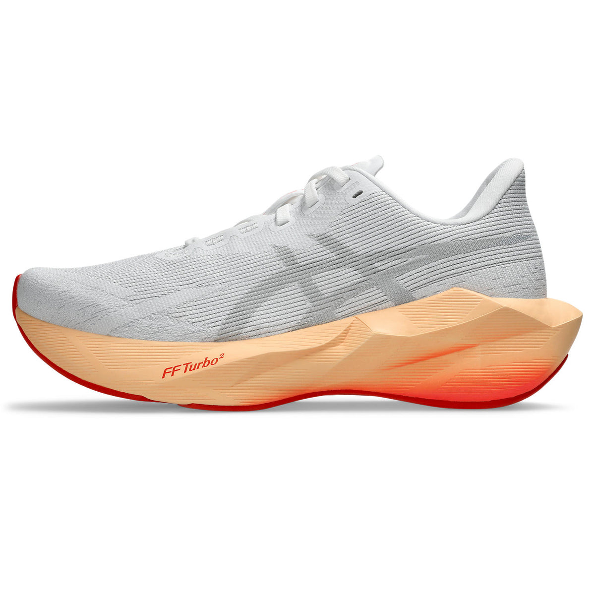 White running shoe with orange sole on a white background