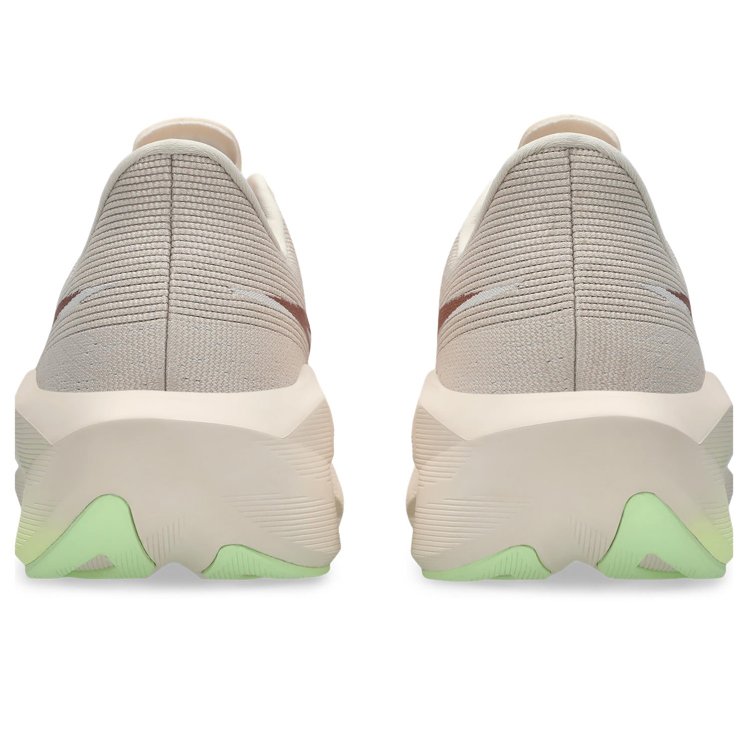 Pair of beige and gray slip-on shoes with green accents on a white background