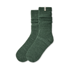 A pair of dark green ribbed knit crew socks with a small white brand tag on the cuff, displayed against a clean white background.