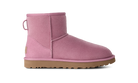 A single pink suede ankle boot with a tan rubber sole, shown in a side profile on a solid white background.