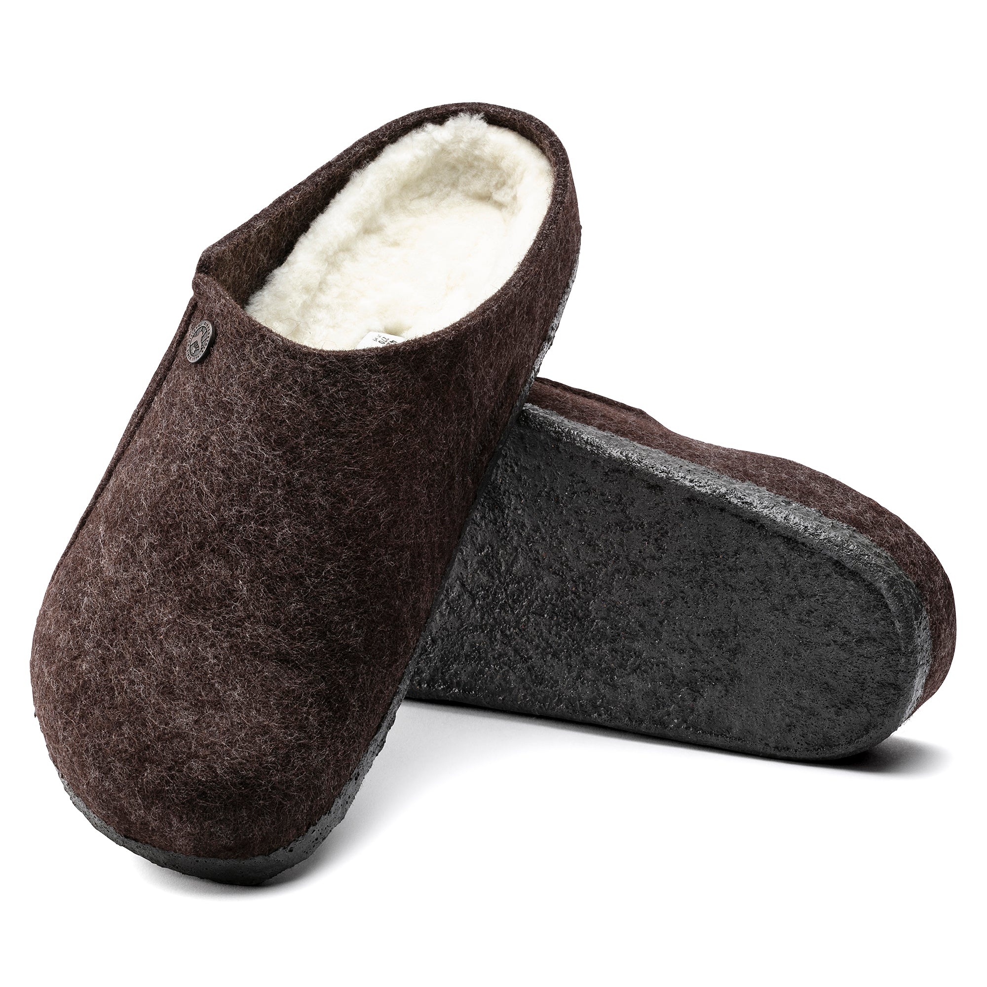 Pair of brown slippers with white lining on a white background