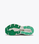 Green and white athletic shoe on a white background