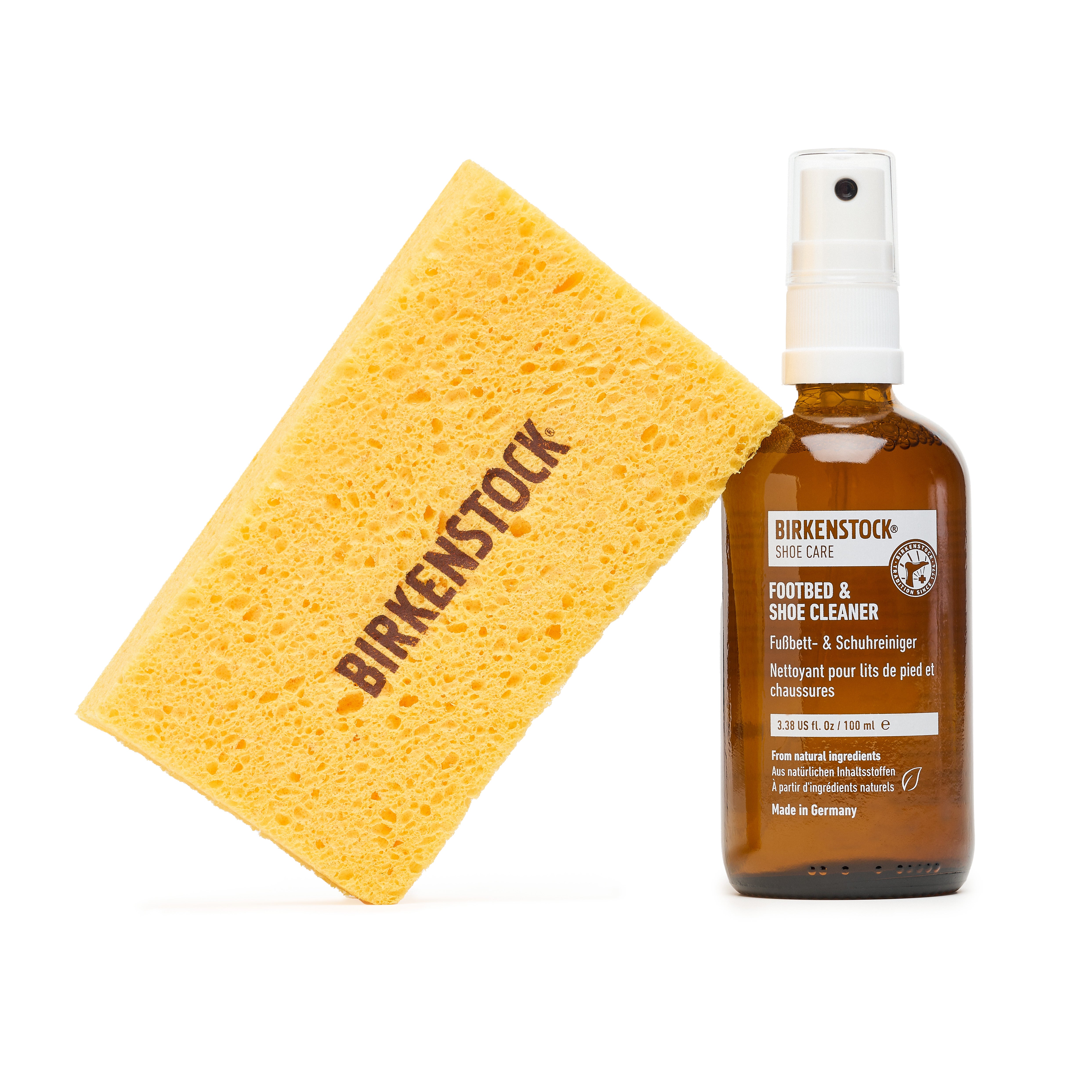 Birkenstock shoe care sponge and cleaner bottle on a white background