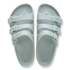 Pair of light blue sandals with multiple straps on a white background