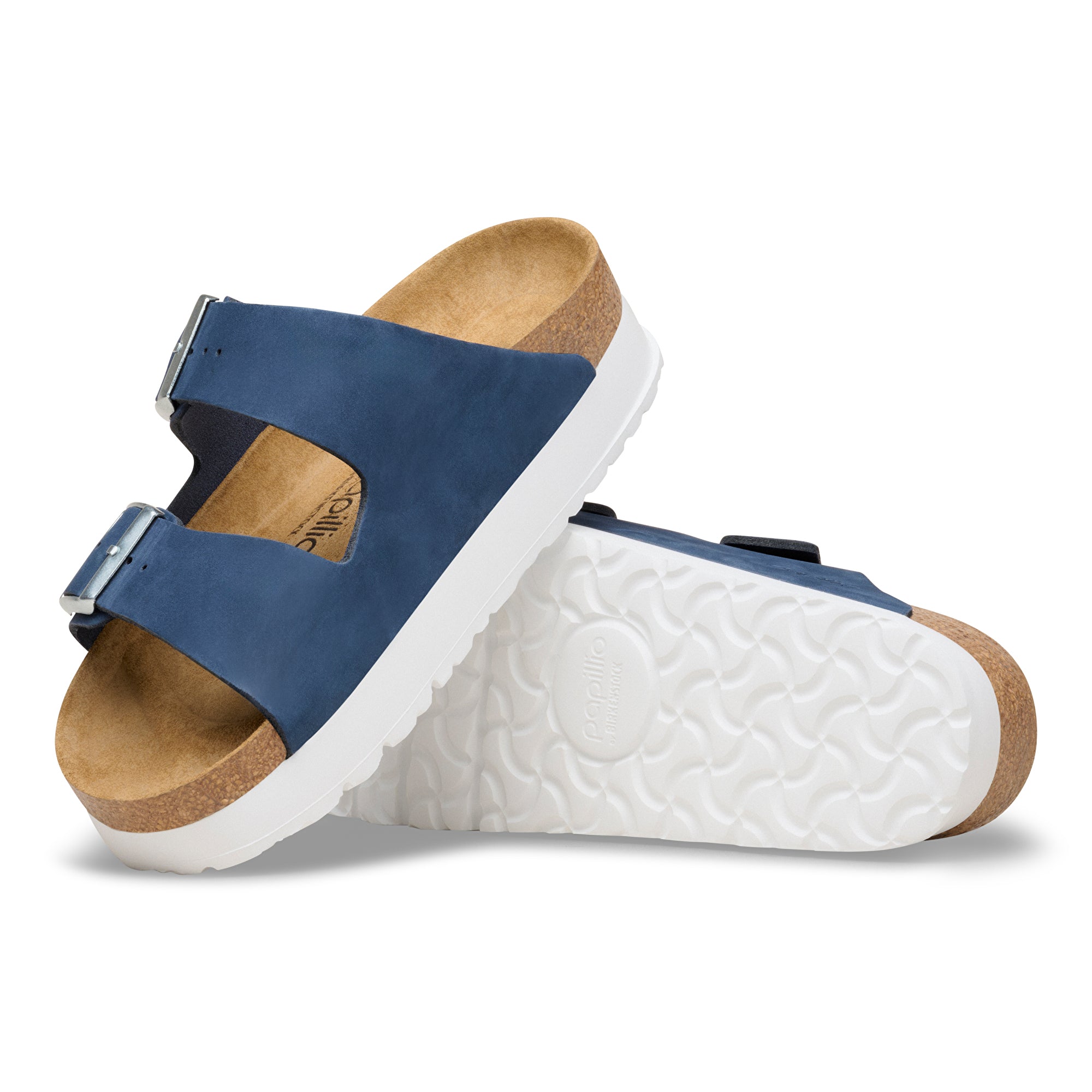 Blue sandal with cork footbed on a white background