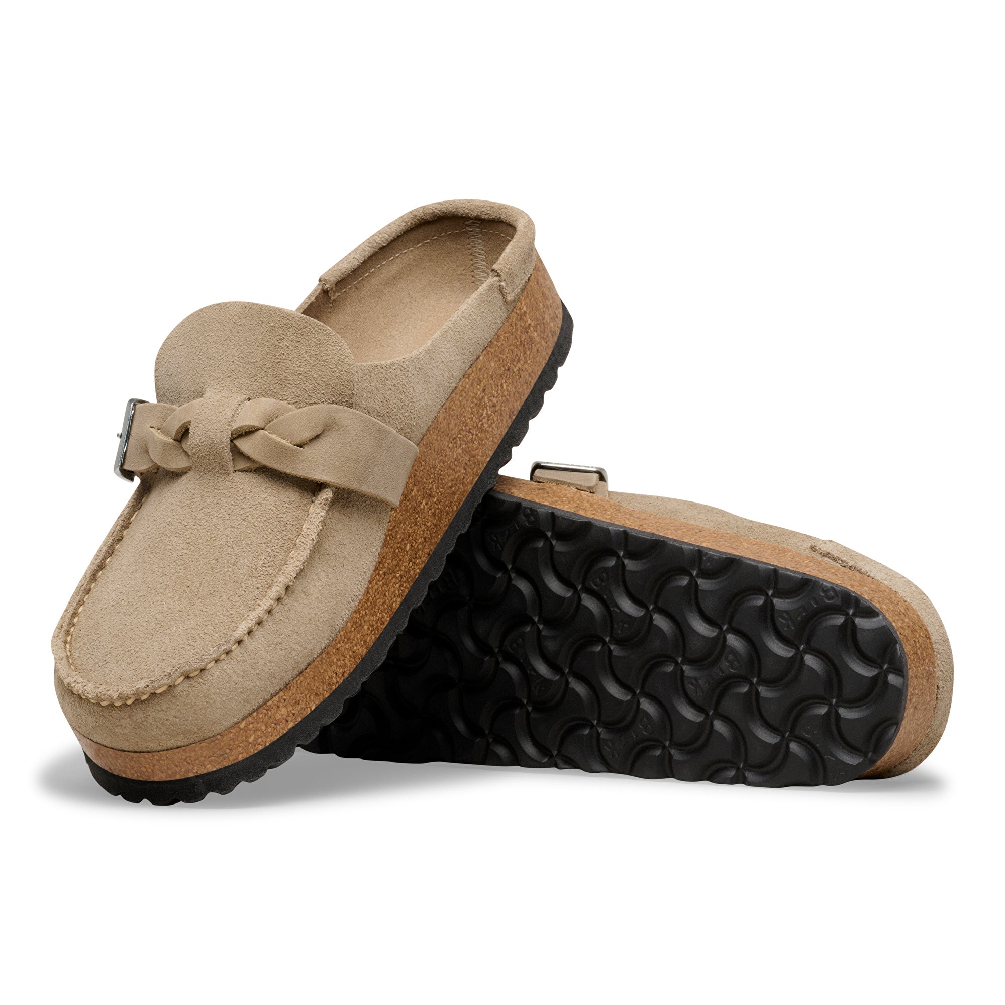 Pair of beige loafers with a textured sole on a white background