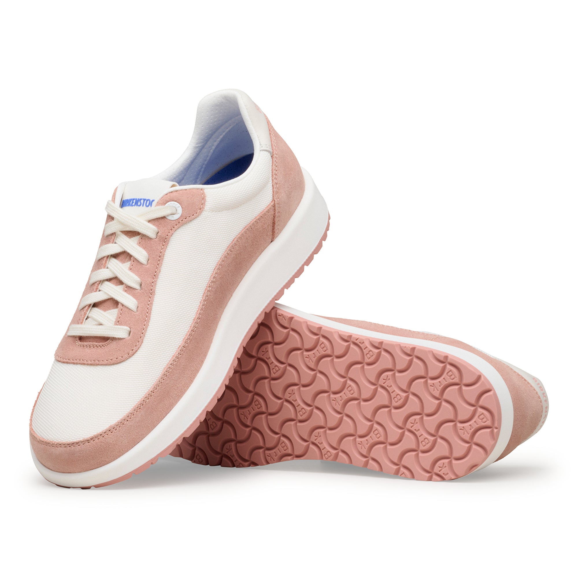 Pair of pink and white sneakers on a white background