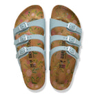 Pair of sandals with floral pattern on a white background