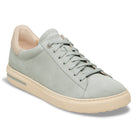 Light gray sneaker with beige accents on a white background