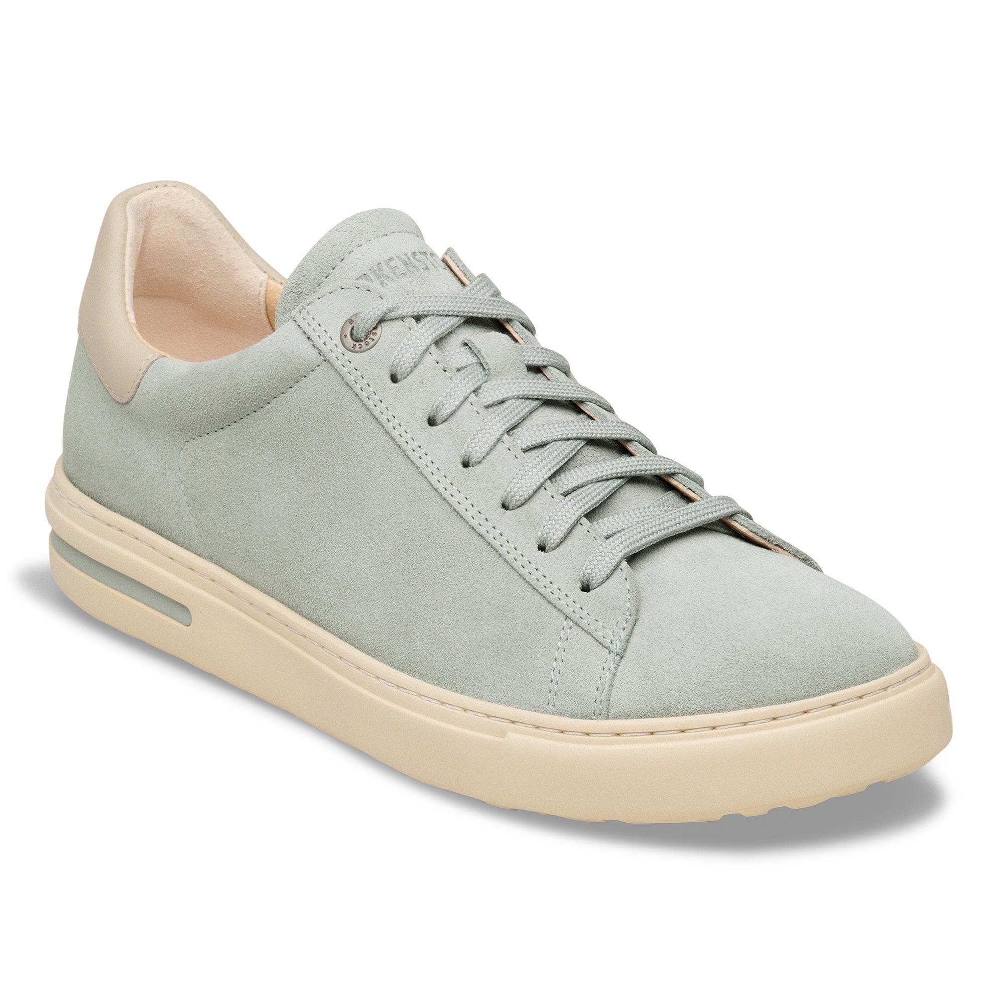 Light gray sneaker with beige accents on a white background