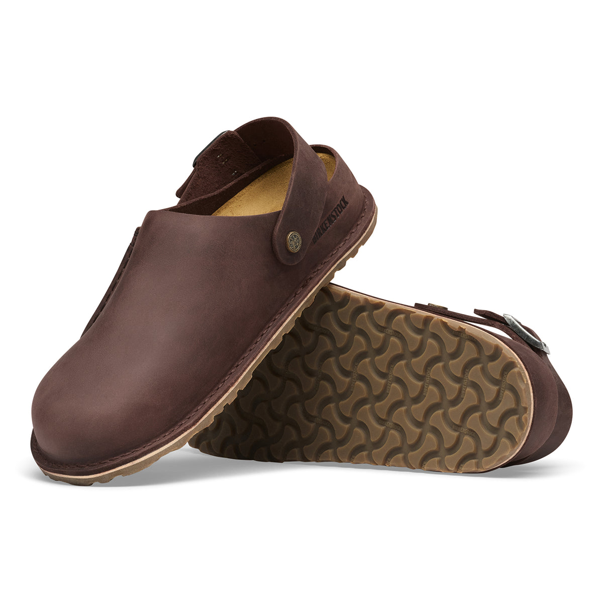 Brown leather shoes with a textured sole on a white background