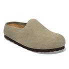 Beige slip-on shoe with brown sole on a white background