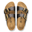 Pair of Birkenstock sandals with brown and black straps on a white background