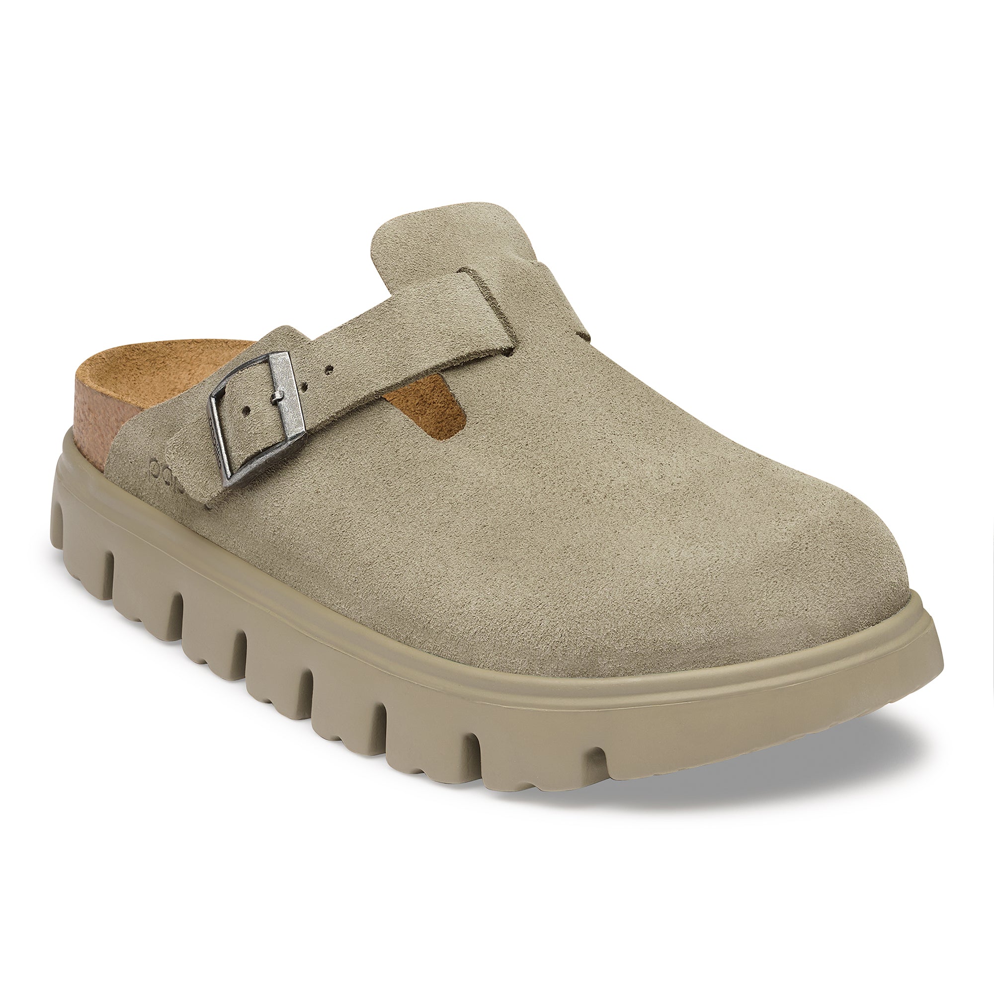 Beige clog shoe with a buckle on a white background