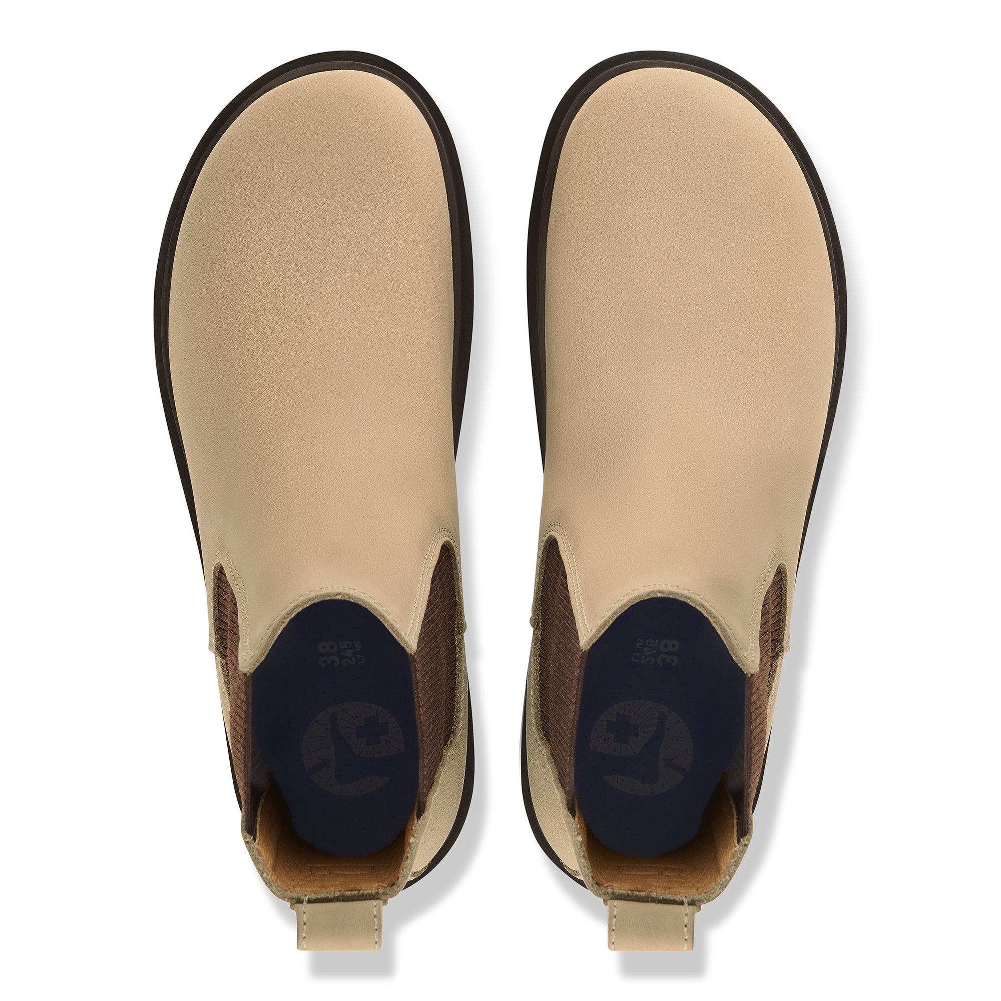 Pair of tan Chelsea boots with brown accents on a white background