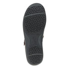 Black sandal sole with textured pattern on a white background