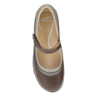 Brown shoe with beige sole on a white background