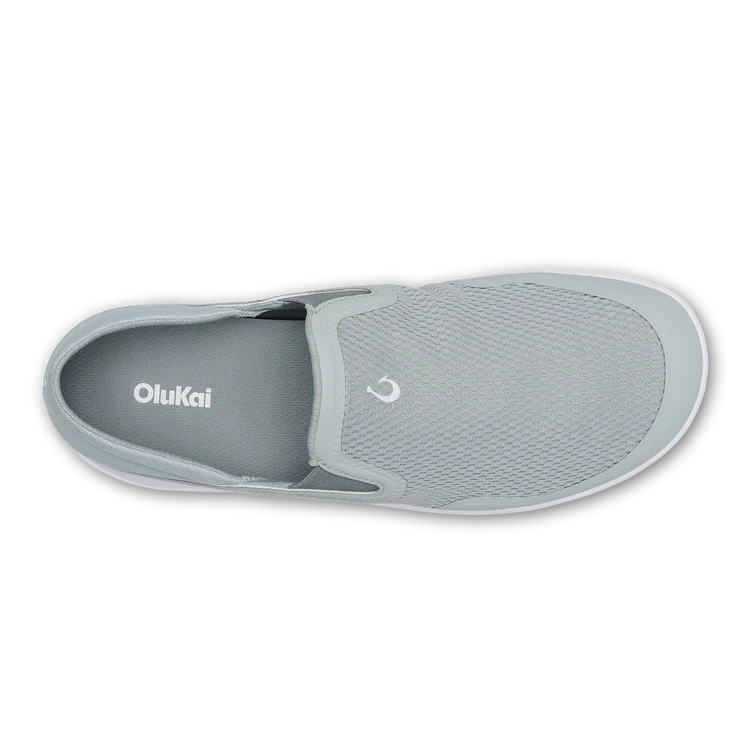 Gray slip-on shoe with 'OluKai' branding on a white background