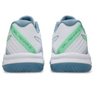 White running shoes with green and blue accents on a white background