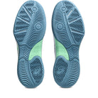 Blue and green athletic shoe sole on a white background