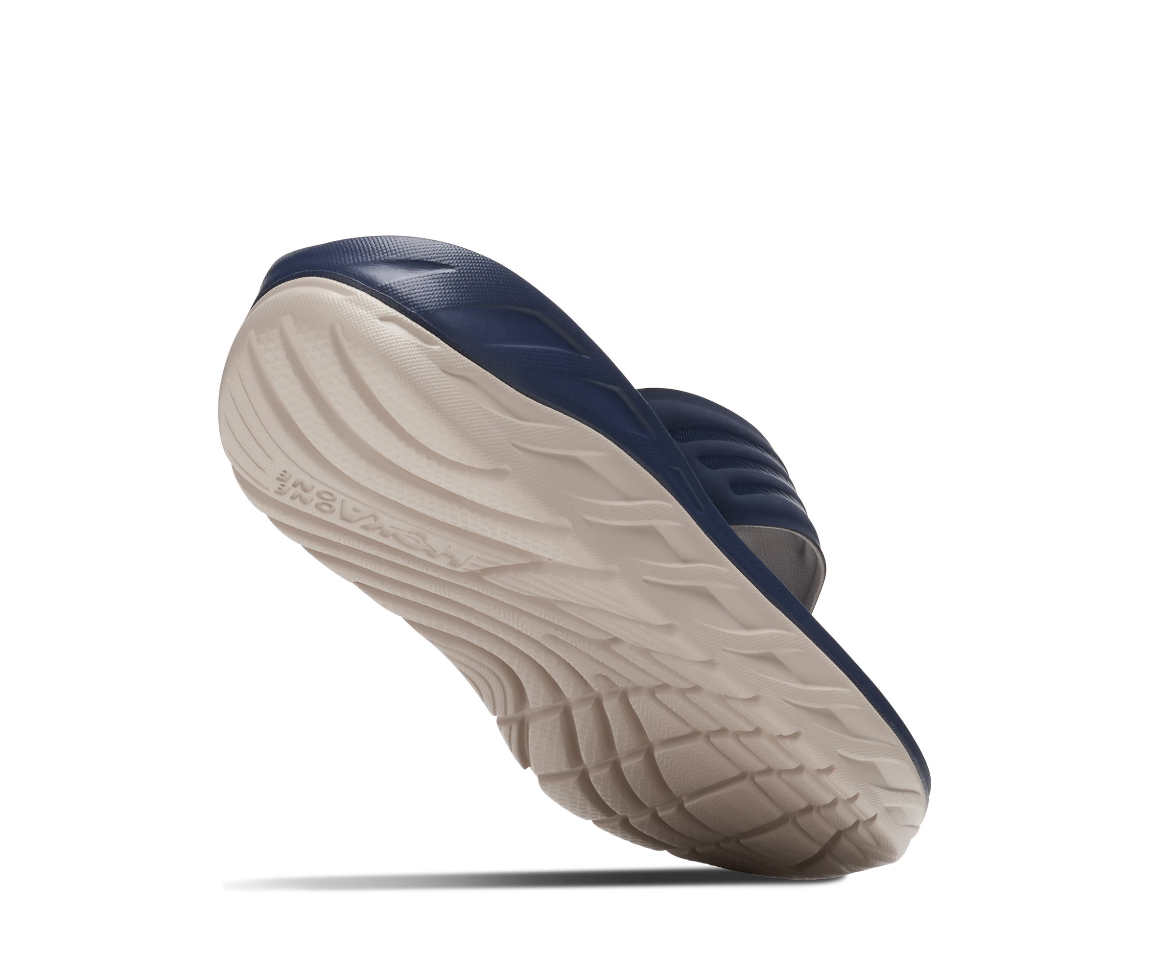 Blue shoe with a white sole on a white background